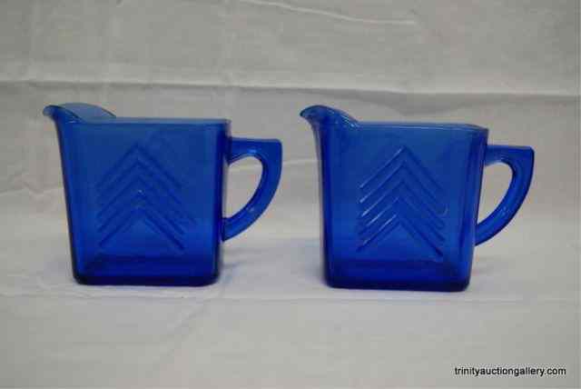 Appraisal: Depression Glass Cobalt Blue Chevron PitchersFrom the depression era produced