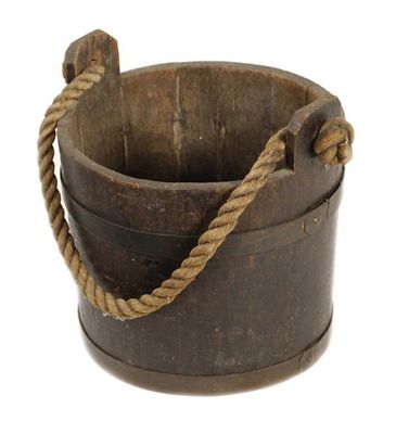 Appraisal: A coopered oak and brass bound bucket with a a