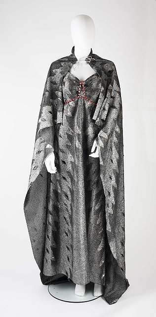 Appraisal: A full length silver and black lame dress and cloak