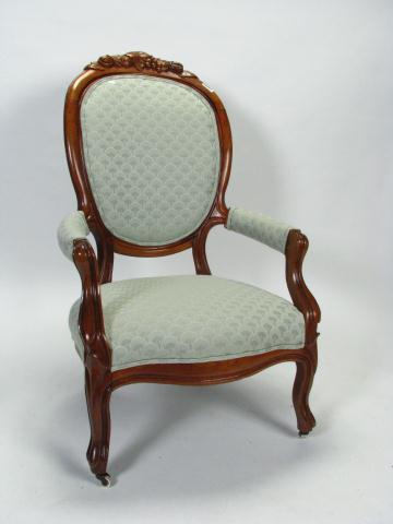 Appraisal: A Walnut Victorian Carved Armchair with nut and leaf motif