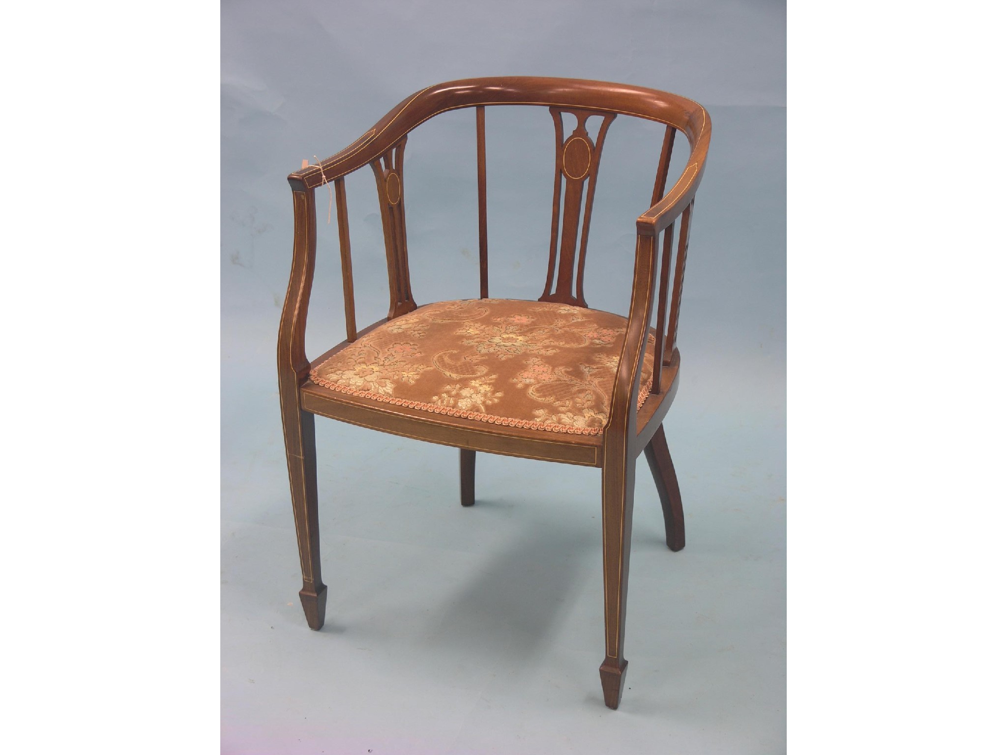 Appraisal: An Edwardian inlaid mahogany elbow chair rounded back with pierced