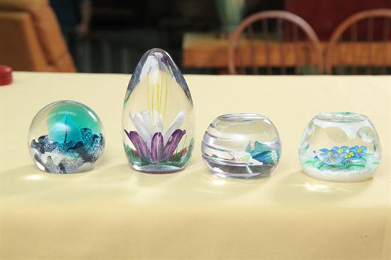 Appraisal: FOUR PAPERWEIGHTS Three Caithness faceted with floral decoration on a