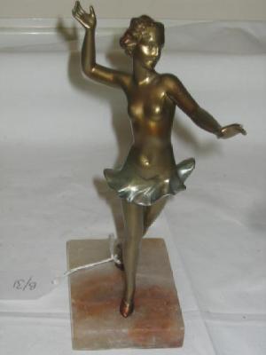 Appraisal: AN ART DECO SPELTER FIGURE modelled as a female dancer