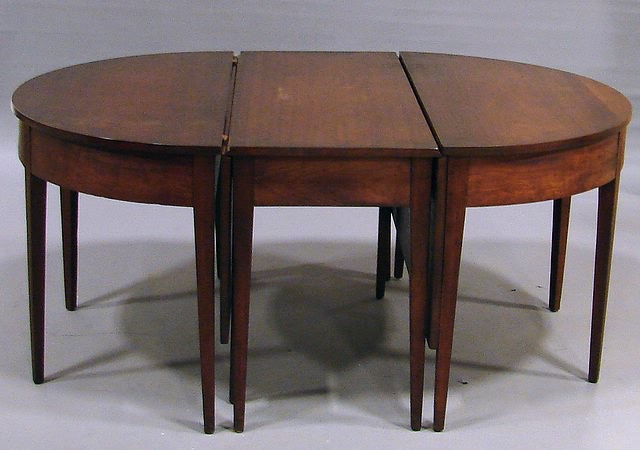 Appraisal: Center section with drop-leaf sides demilune-top end sections tapered square