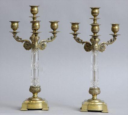 Appraisal: PAIR OF FRENCH CUT-GLASS AND BRASS FOUR-LIGHT CANDELABRA Each -sided