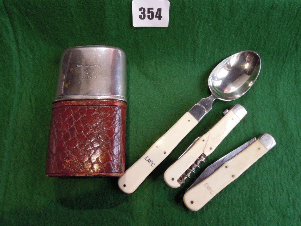 Appraisal: A Victorian silver plate and leather campaign cutlery container complete