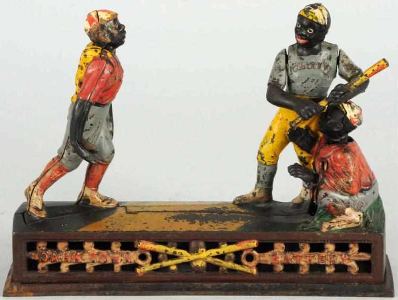 Appraisal: Cast Iron Darktown Battery Mechanical Bank Manufactured by J E