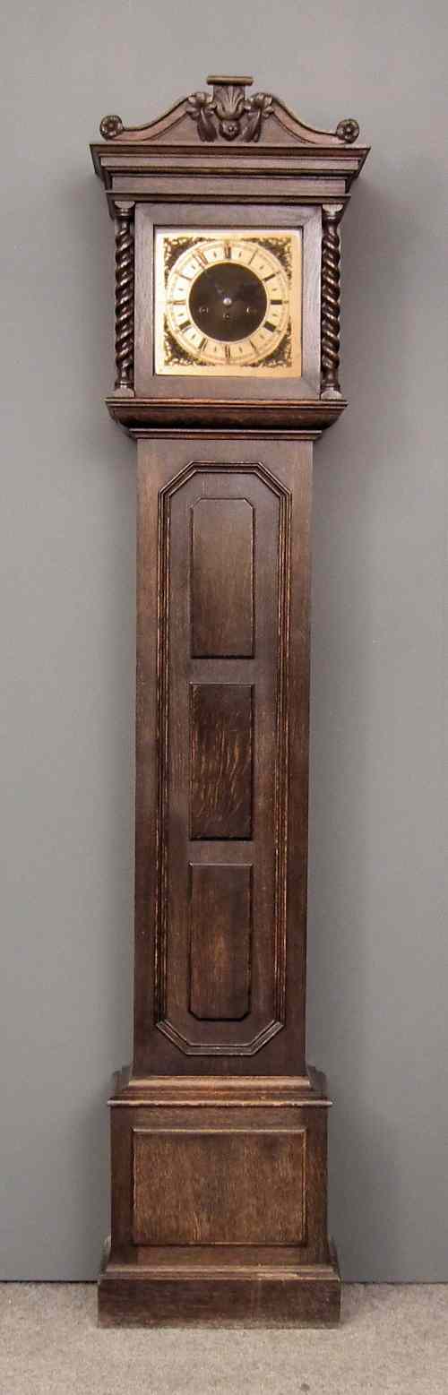 Appraisal: A s dark oak longcase clock of ''Jacobean'' design the