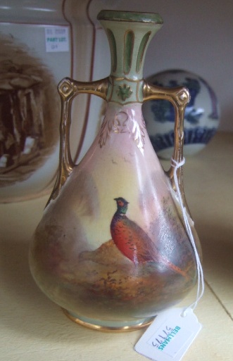 Appraisal: A Crown Devon twin handle vase painted with pheasants signed