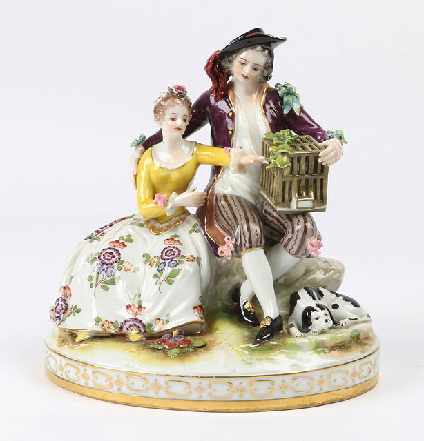 Appraisal: A NAPLES PORCELAIN GROUP of lovers with a bird cage