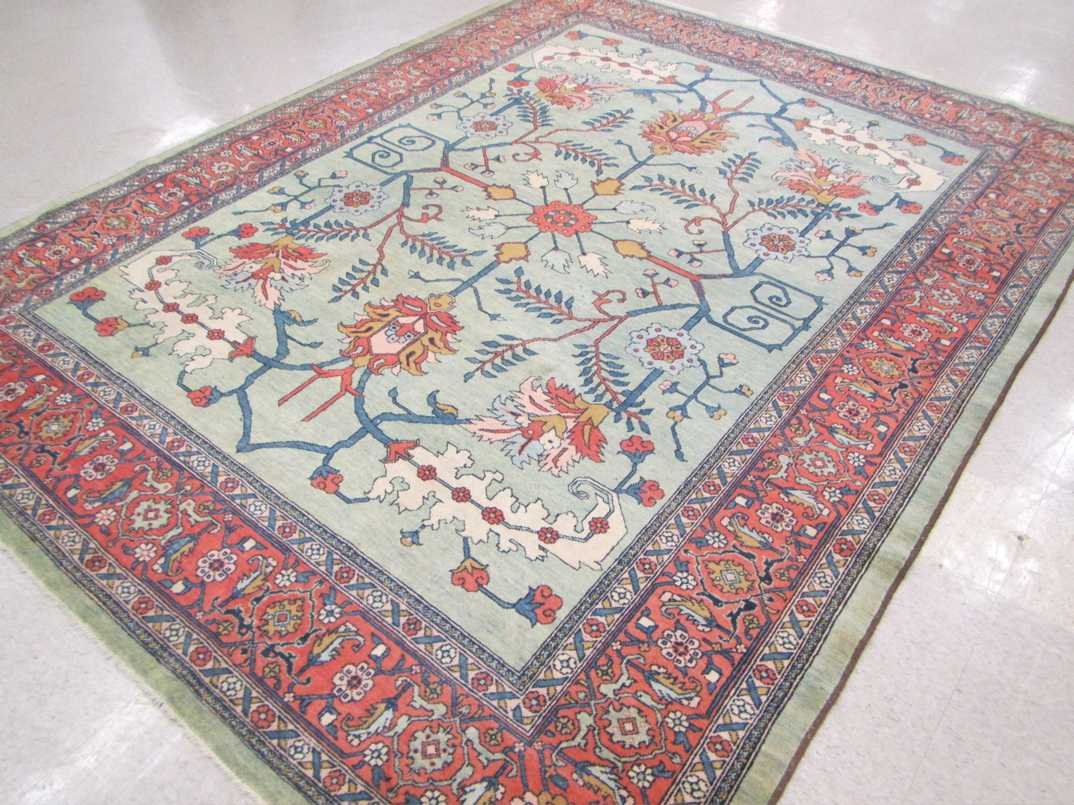 Appraisal: HAND KNOTTED ORIENTAL CARPET Persian Serapi design with stylized floral