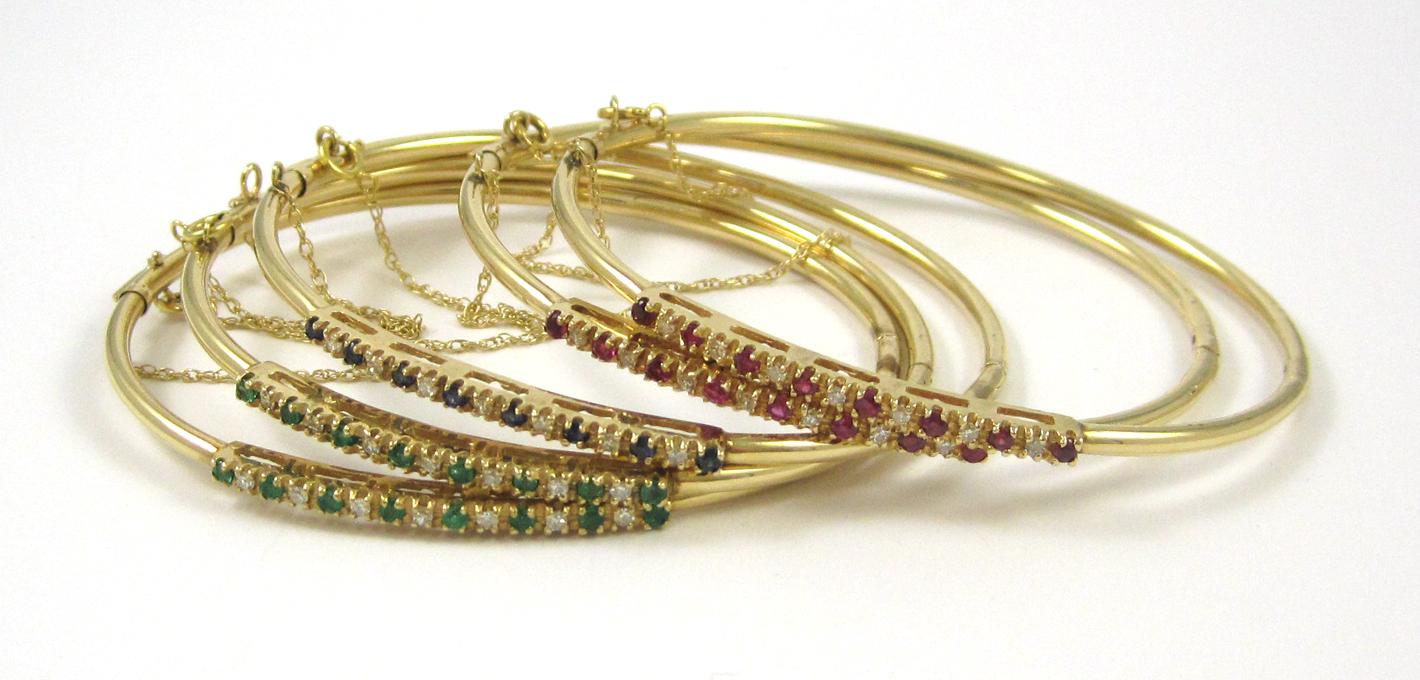 Appraisal: FIVE MATCHING FOURTEEN KARAT GOLD BANGLES including two with round-cut