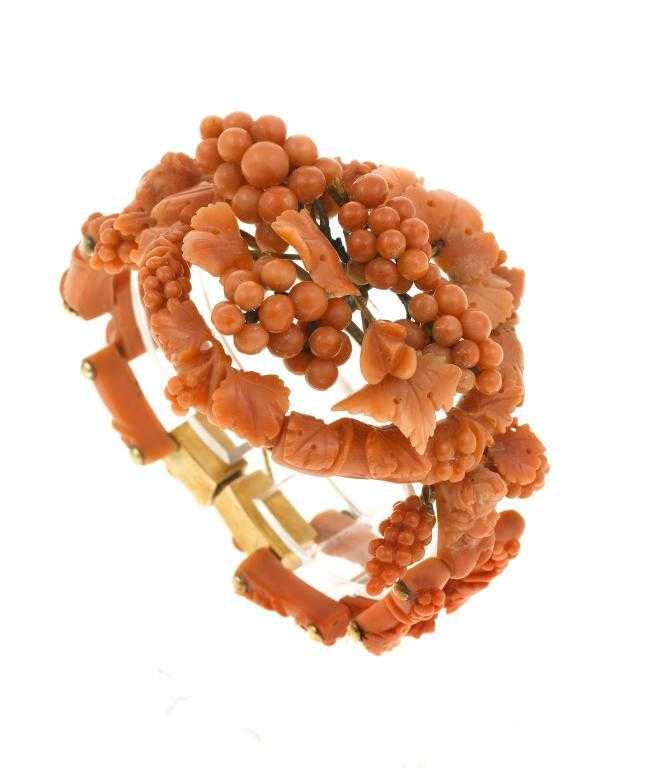 Appraisal: AN ANTIQUE CORAL BRACELET carved with vines and bunches of