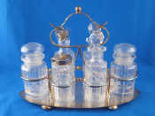 Appraisal: A silver plated six bottle cruet and frame x cm