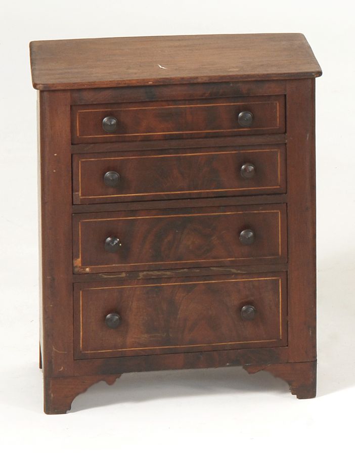 Appraisal: MINIATURE FOUR-DRAWER CHEST th CenturyIn mahogany and mahogany veneers Line