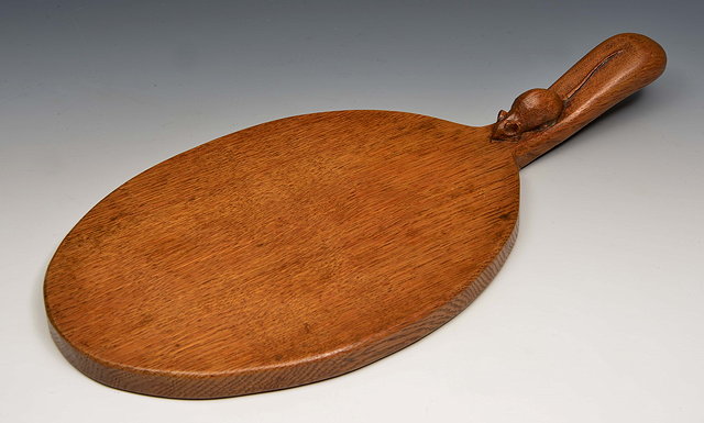 Appraisal: Robert Thompson British - of KilburnMouseman oak cheese board adzed