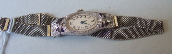 Appraisal: A ladies platinum cased diamond and sapphire set dress wristwatch