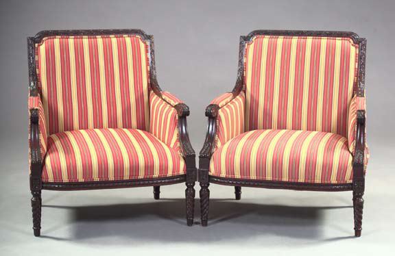 Appraisal: Pair of Louis XVI-Style Stained Mahogany Bergeres the back frames