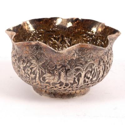 Appraisal: An Indian white metal sugar basin profusely chased with figures