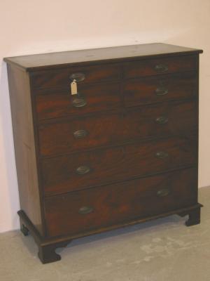 Appraisal: A MAHOGANY CHEST with moulded edged top four small cockbeaded