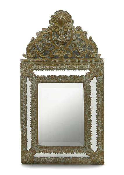 Appraisal: A Spanish Baroque style brass repousse mirror with marginal plates