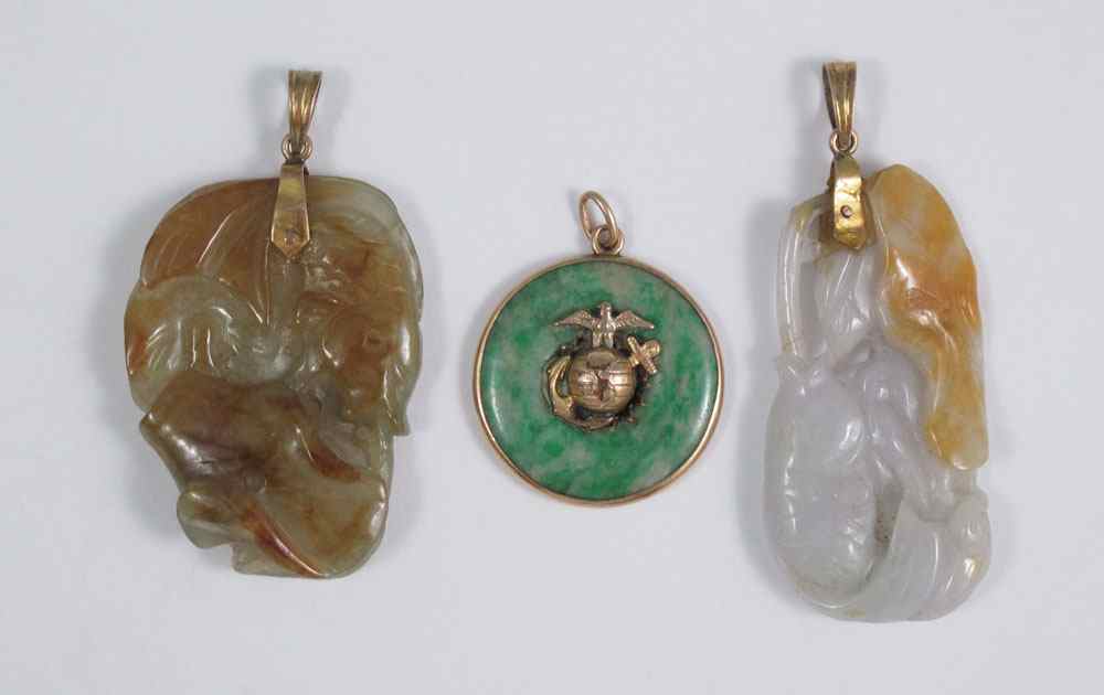 Appraisal: CARVED JADEITE JADE PENDANTS FISH carved in gray and brownish