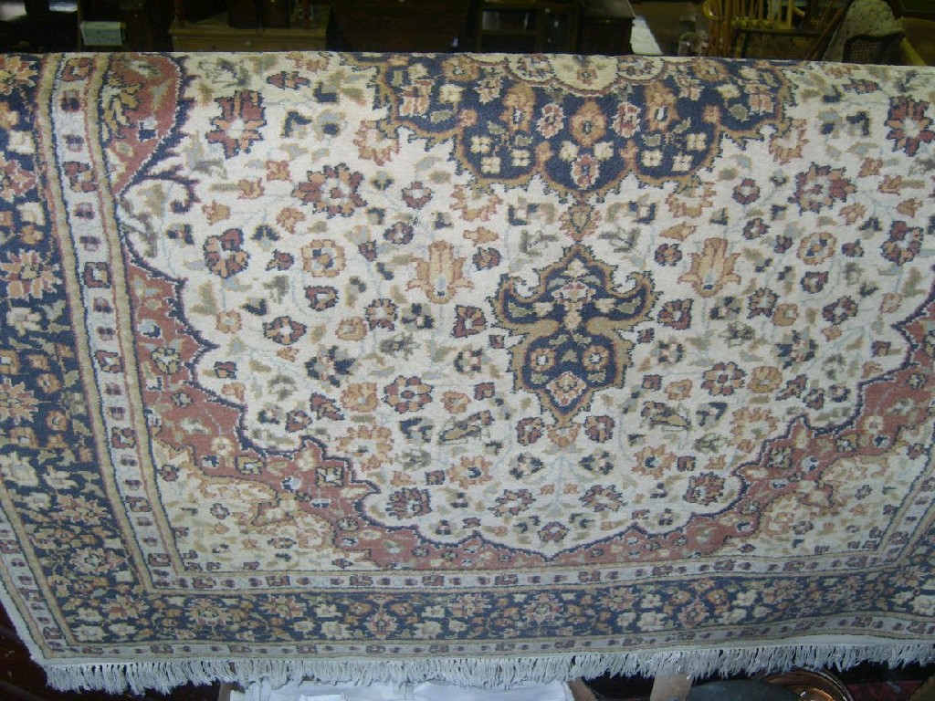 Appraisal: A Persian style wool rug with beige field central medallion