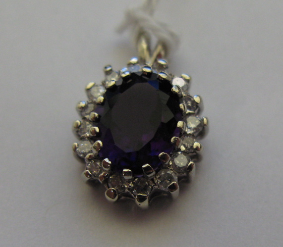 Appraisal: AMETHYST DIAMOND AND FOURTEEN KARAT WHITE GOLD PENDANT round-cut diamonds