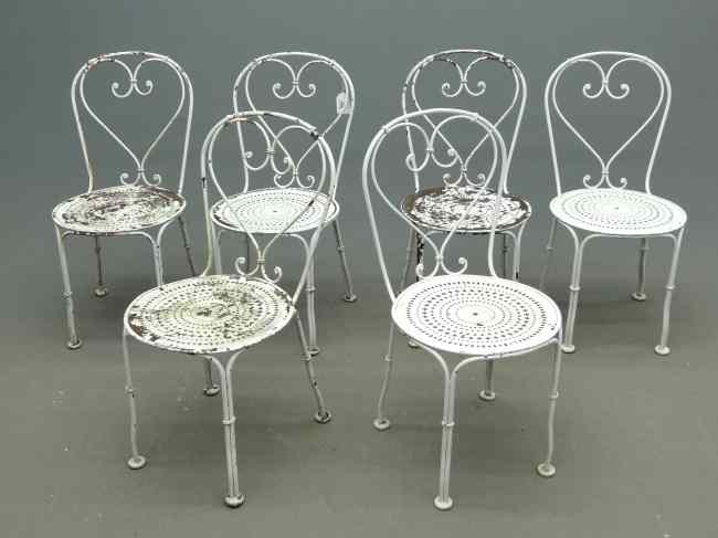 Appraisal: Set of six pierced seat garden chairs in white paint