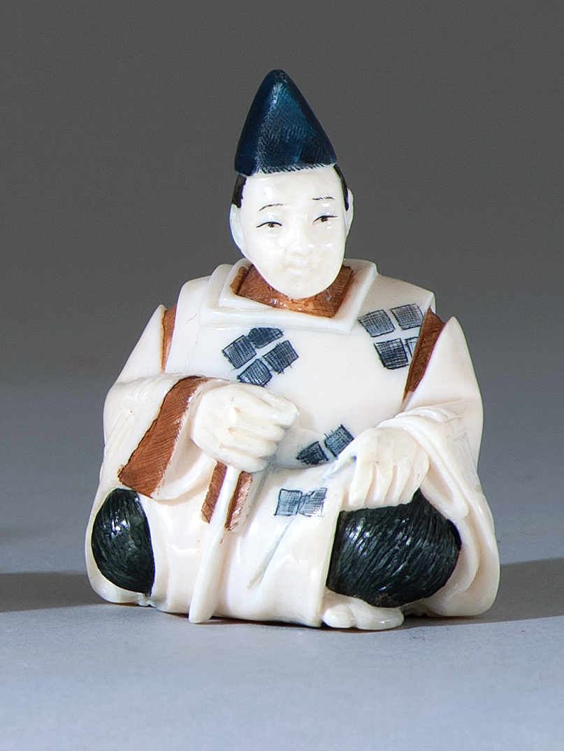 Appraisal: POLYCHROME IVORY NETSUKE In the form of a seated scholar