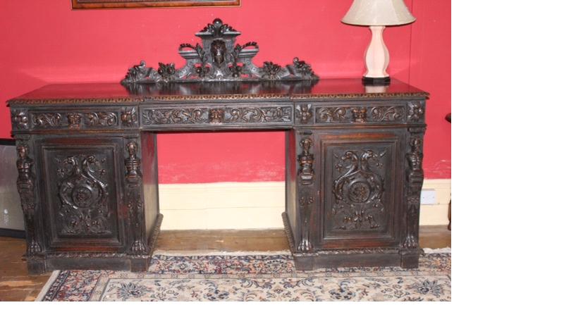 Appraisal: A thC Flemish style oak twin pedestal sideboard with carved