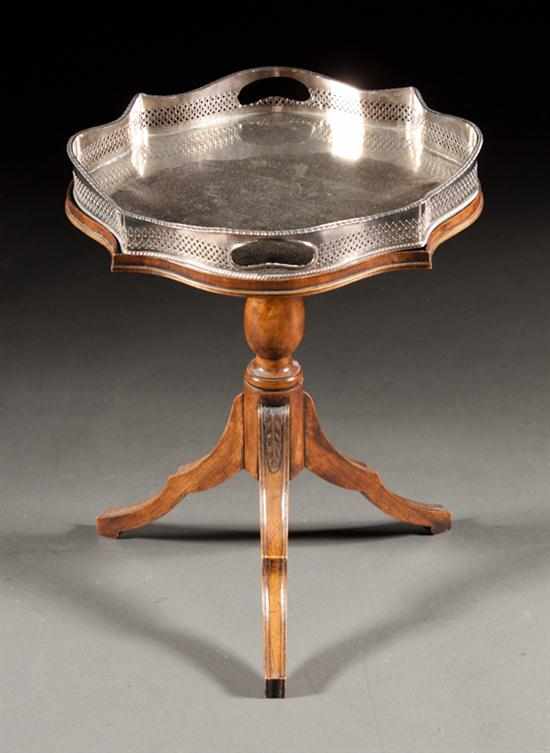 Appraisal: Regency style mahogany shaped-top table with inset Sheffield silver-plated galleried