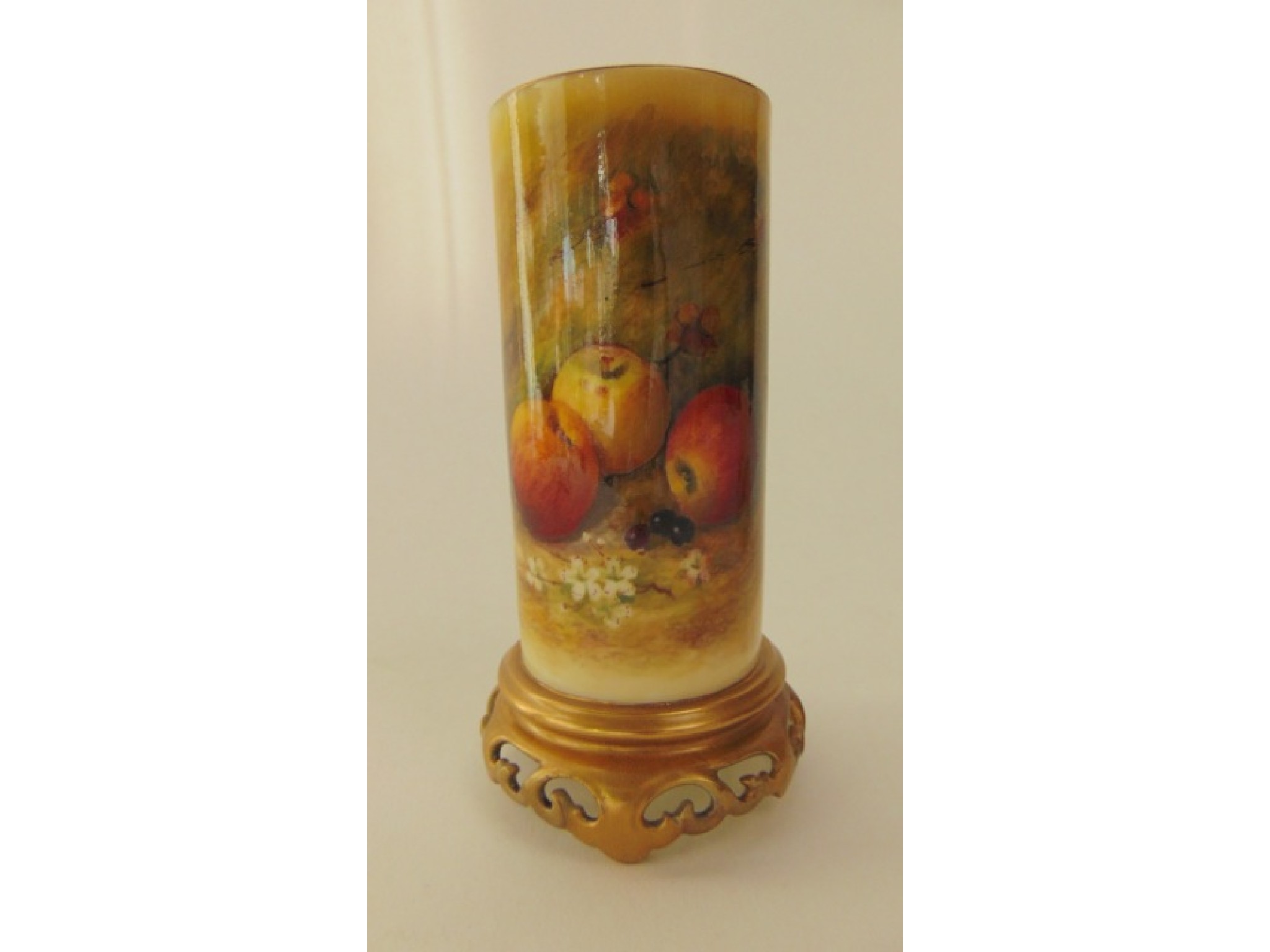 Appraisal: A Royal Worcester ivory ground vase of cylindrical form raised