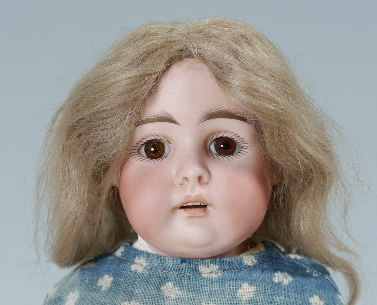 Appraisal: ANTIQUE BISQUE HEAD DOLL '' tall Stationary brown eyes rosy