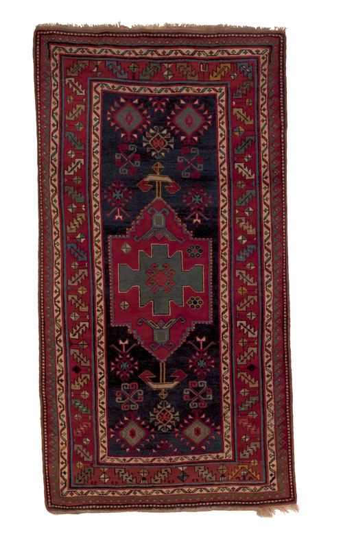 Appraisal: Kazak carpet ca with a central red medallion on a