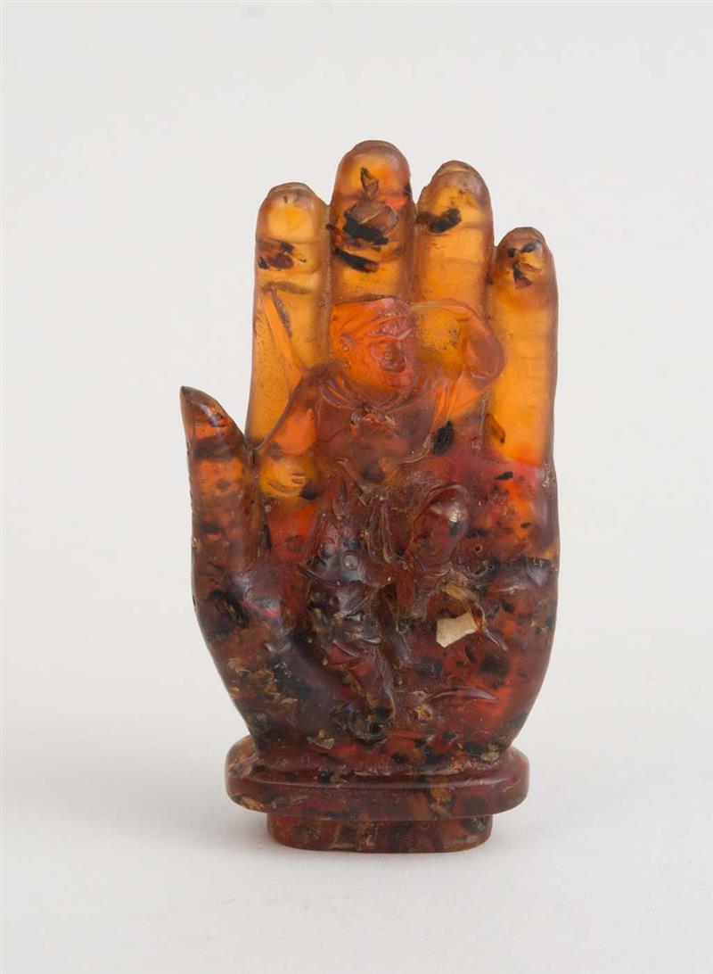 Appraisal: ASIAN RESIN MODEL OF A HAND Marked with characters on