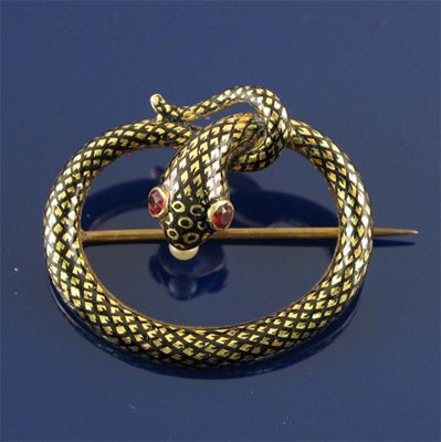 Appraisal: A Victorian snake brooch realistically formed with black enamelled scales