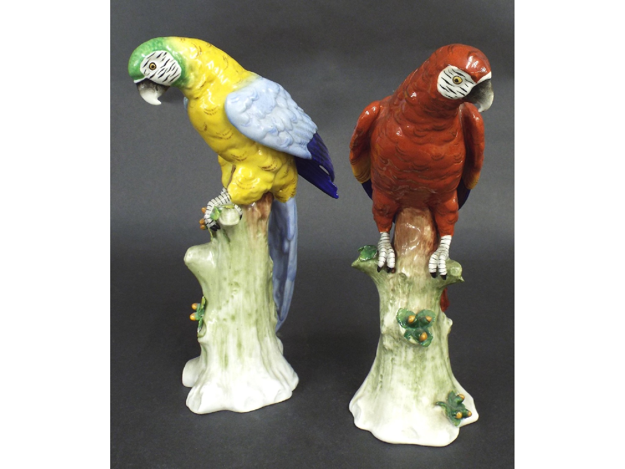 Appraisal: Pair of Sitzendorf porcelain parrots each upon naturalistic bases underglaze