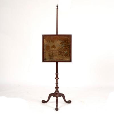 Appraisal: A mahogany pole screen with vase finial the machine worked