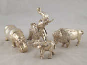 Appraisal: Four silver cased composition animals being two elephants a hippopotamus