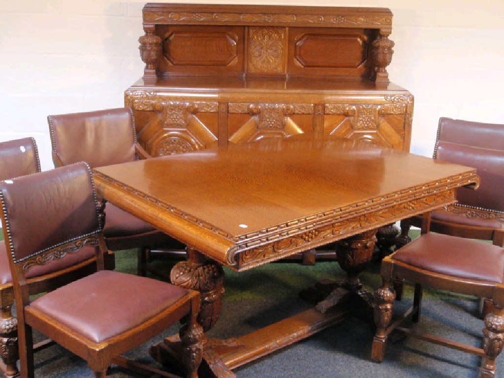 Appraisal: A 's oak draw leaf dining table with four chairs