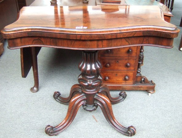 Appraisal: An early th century rosewood card table the serpentine fold