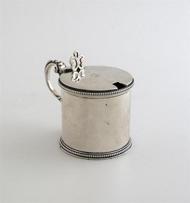 Appraisal: A Victorian mustard pot with bead borders scroll handle and