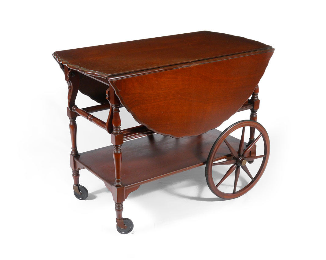 Appraisal: MAHOGANY DROP LEAF TEA CART Pie crust top with double