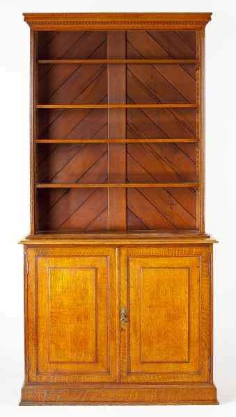 Appraisal: English Golden Oak Open Bookcasecirca a dentil molded cornice surmounts