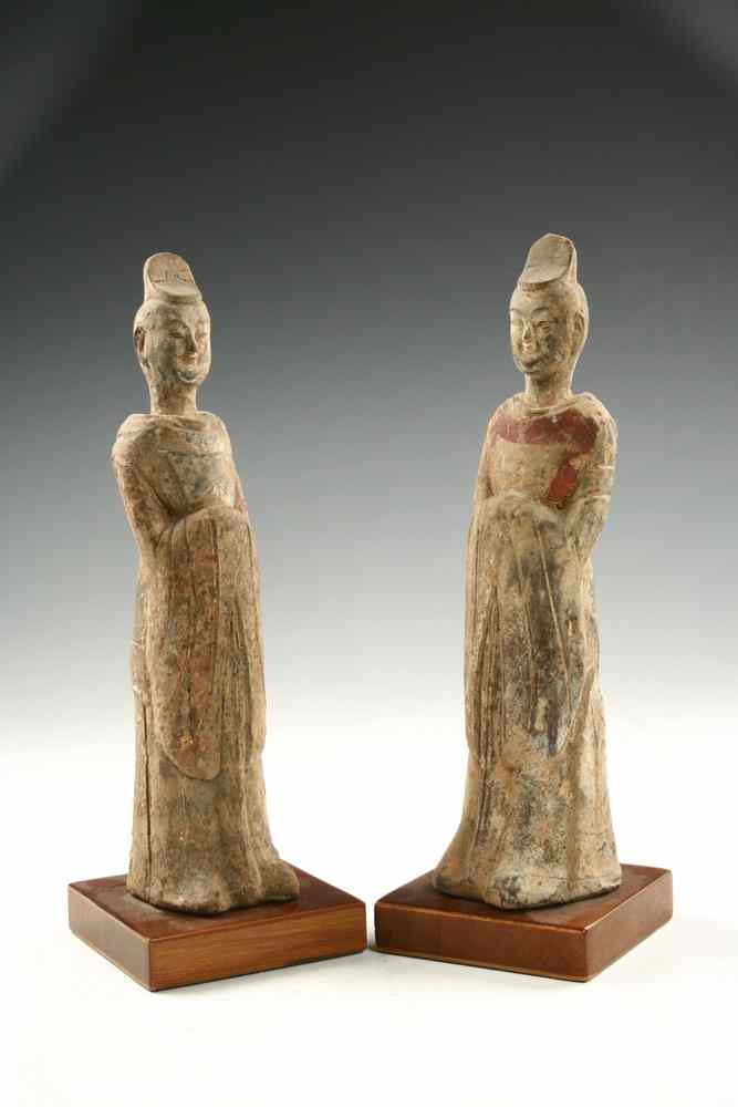 Appraisal: FIGURINES - Northern Wei Dynasty two similar unglazed buff pottery