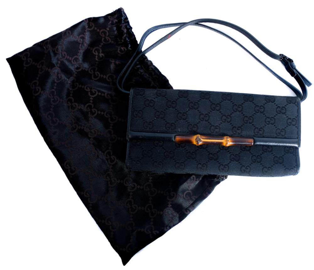 Appraisal: VINTAGE GUCCI CLUTCH IN MONOGRAM CANVASVintage Gucci clutch in nero