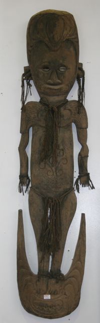 Appraisal: A Sepik River basket hook carved as a male figure