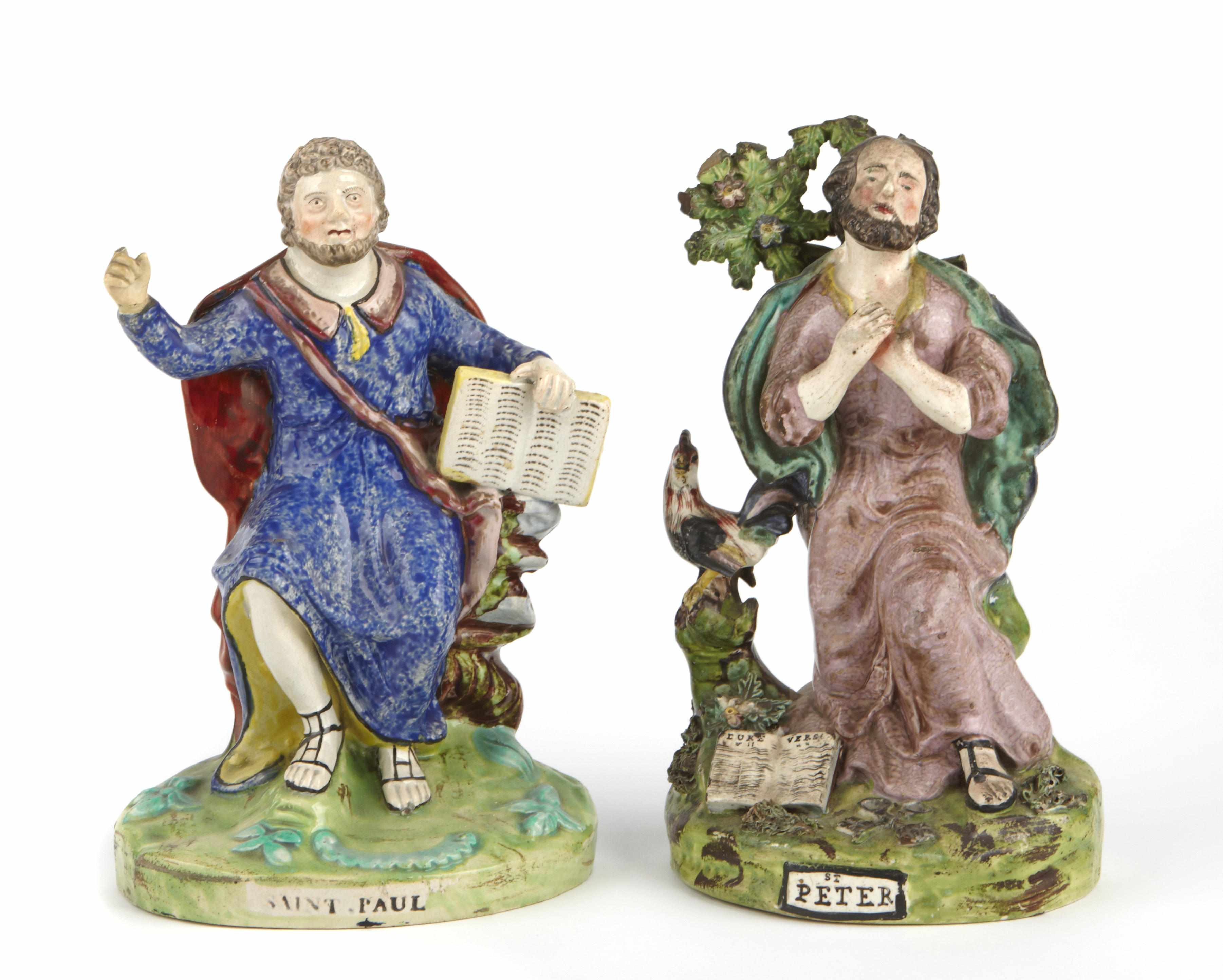 Appraisal: A group of two Staffordshire figures of saints Depicting Saint