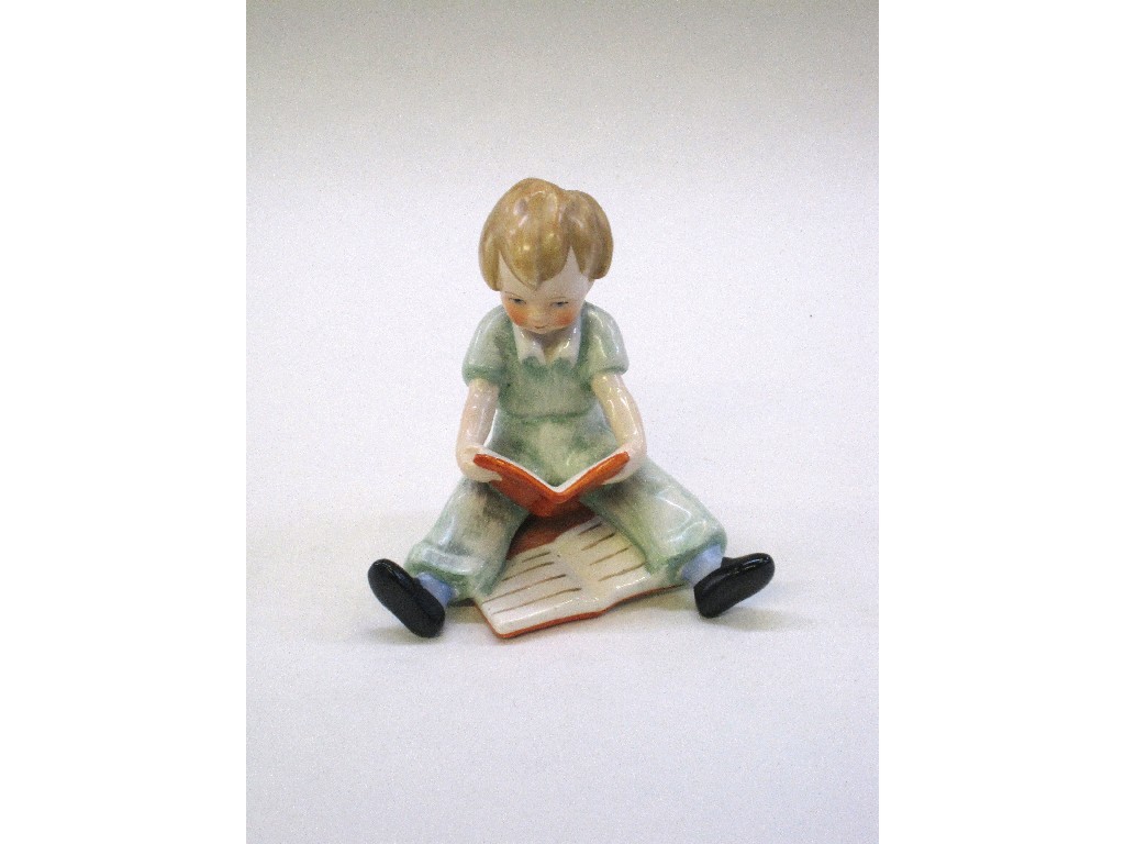 Appraisal: Goebel figure of a seated young boy reading a book